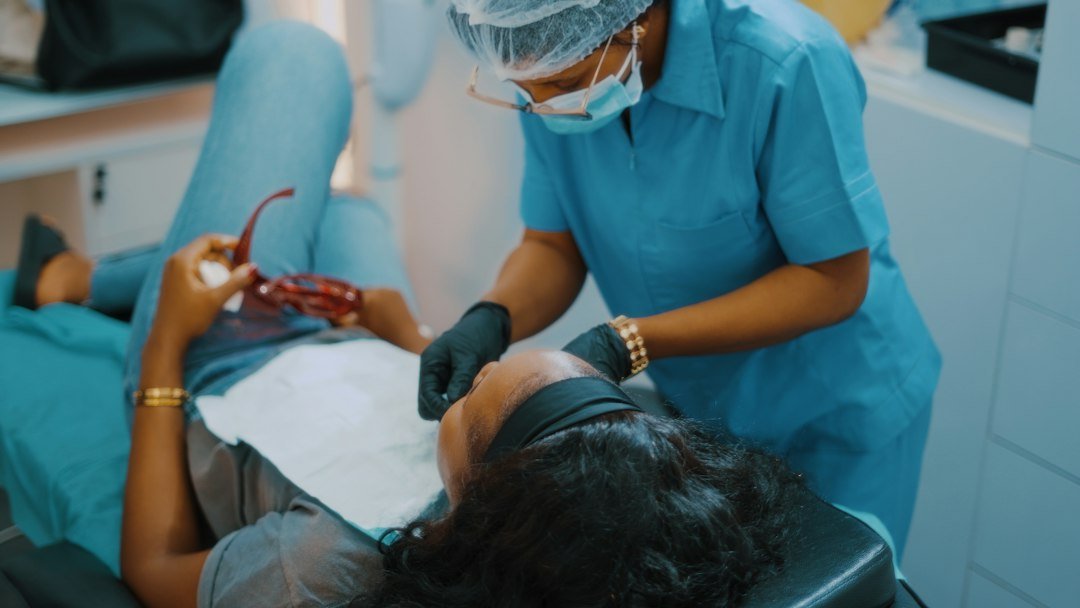 Dentist examining a patient during a dental consultation